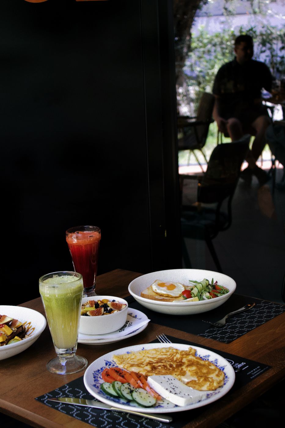Breakfast table with fresh juices on the terrace