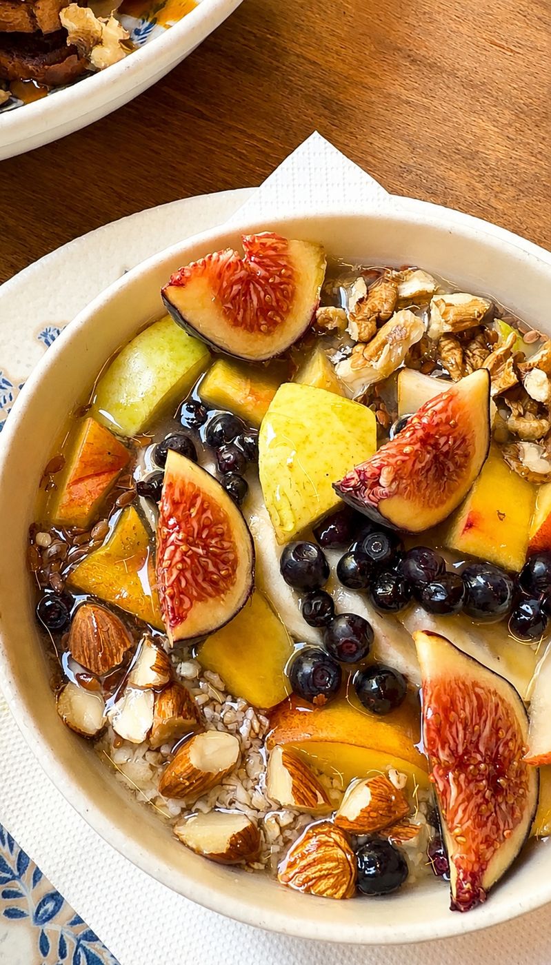 Granola and yogurt bowl with figs, blueberries and nuts