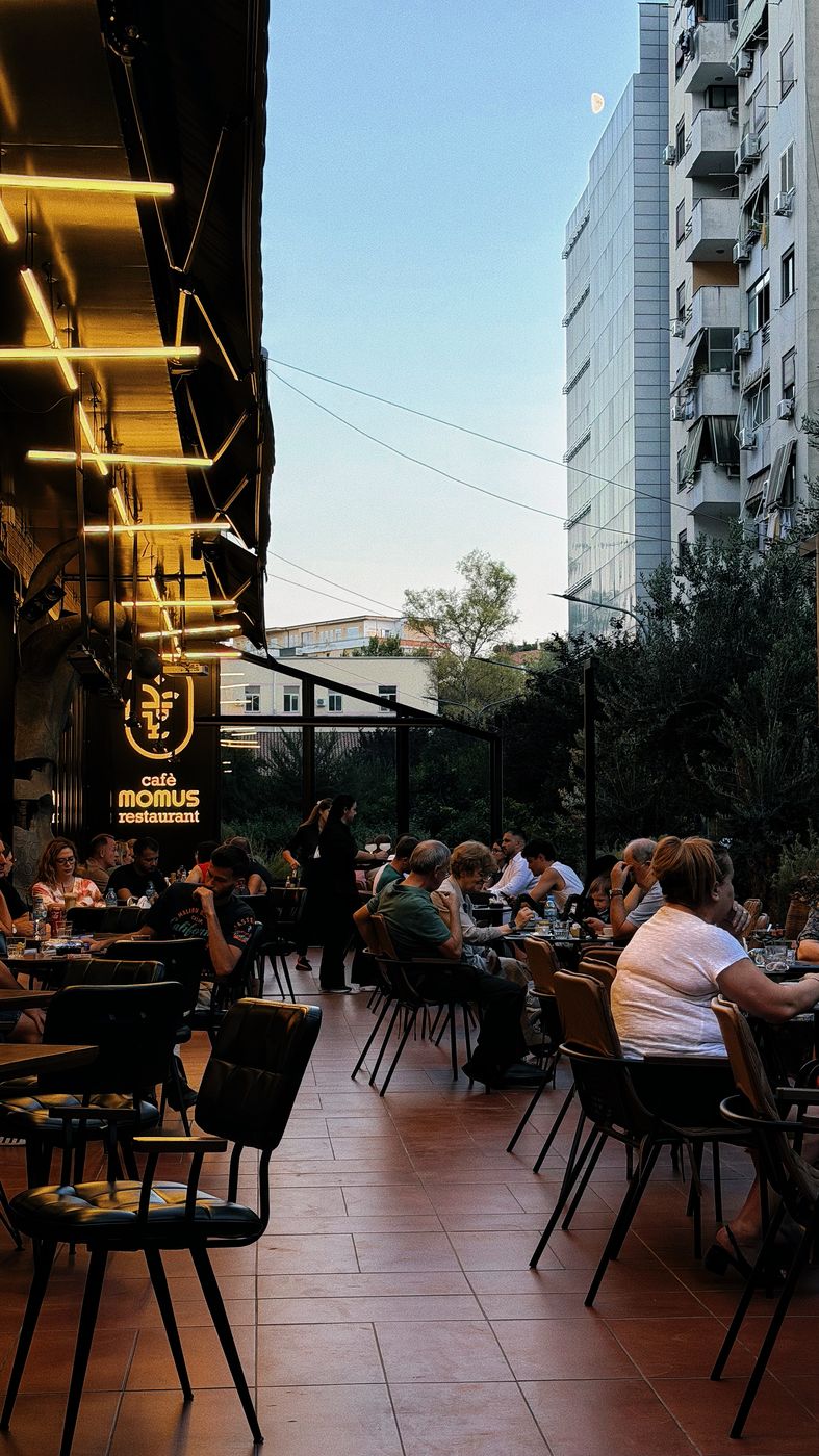 Café Momus terrace with Tirana skyline behind